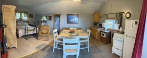 Panoramic shot of the interior of a vacation rental kitchen