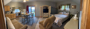 Panoramic shot of the interior of a vacation rental cabin