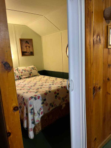 Bedroom, photographed through a doorway