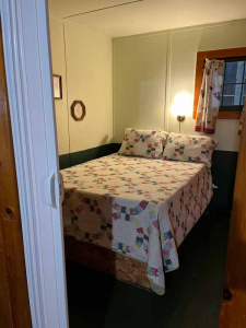 Bedroom, photographed through a doorway