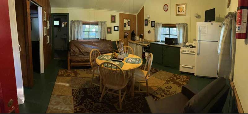 Panoramic shot of the interior of a vacation rental cabin