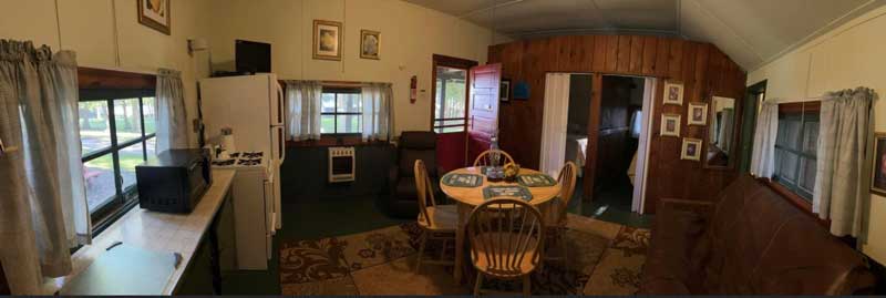 Panoramic shot of the interior of a vacation rental cabin